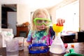 Little Child Doing a Science Experiement with Toy Scientist Kit