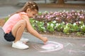 Little child drawing heart with chalk Royalty Free Stock Photo