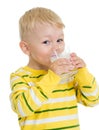 Little child drinking milk or kefir isolated