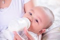 Little child drinking milk from bottle Royalty Free Stock Photo