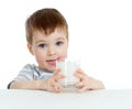 Little child drinking yogurt or kefir over white