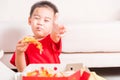 Little Child eating Delivery Pizza and show good finger thumb Royalty Free Stock Photo