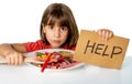 Little child eating sweet sugar in candy dish holding sugar spoo Royalty Free Stock Photo