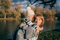 Little child embracing his mom. Family having fun in autumn park outdoors, hugging, laughing, relaxing, enjoy life. Close up sunny Royalty Free Stock Photo