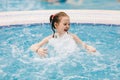 Little child enjoying her time in a hot tub. Royalty Free Stock Photo
