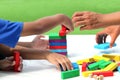 Little child and family playing wood colors block game in activity learning develop IQ of kids, wooden block toy for fun education