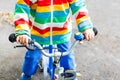 Little child on first bike. Hands of kid. Royalty Free Stock Photo