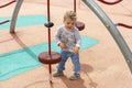 Little child girl boy on the playground. 1 year european caucasian