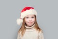 Little child girl, Christmas portrait. Happy kid Santa on white background Royalty Free Stock Photo