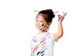 little child girl in colorful paint with paintbrush in hair Royalty Free Stock Photo