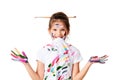 little child girl in colorful paint with paintbrush in hair Royalty Free Stock Photo