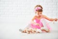 Little child girl dreams of becoming ballerina with ballet shoe Royalty Free Stock Photo