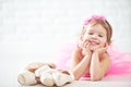 Little child girl dreams of becoming ballerina with ballet shoe Royalty Free Stock Photo