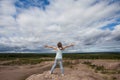 Little child girl embracing world universe against sky clouds outdoors Royalty Free Stock Photo