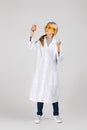Little child girl holding a chemical flask and test tube Royalty Free Stock Photo