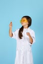 Little child girl holding a chemical flask and test tube Royalty Free Stock Photo