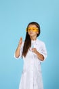 Little child girl holding a chemical flask and test tube Royalty Free Stock Photo