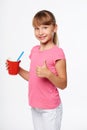 Little child girl holding a drink in disposable paper cup Royalty Free Stock Photo