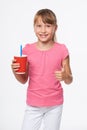 Little child girl holding a drink in disposable paper cup Royalty Free Stock Photo