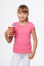 Little child girl holding a drink in disposable paper cup Royalty Free Stock Photo