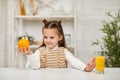 little child girl holding oranges and juice Royalty Free Stock Photo