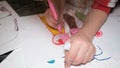 Little child girl painting drawing his family at home,kids immagination creativity in lockdown time