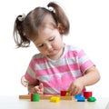 Little child girl playing with puzzle toys Royalty Free Stock Photo