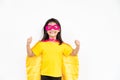 Little child girl plays superhero. Child on the white background. Girl power concept Royalty Free Stock Photo