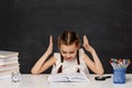 little child girl reading a book in the classroom Royalty Free Stock Photo