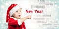 Little Child Girl in Santa Hat Pointing to New Year Royalty Free Stock Photo