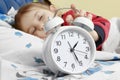 Little child girl sleeping in bed with alarm clock Royalty Free Stock Photo