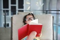 Little child girl wear Glasses reading book in library, Education concept Royalty Free Stock Photo