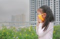 Little child girl wearing a protection mask against PM 2.5 air pollution in Bangkok city. Thailand Royalty Free Stock Photo