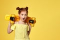 little child girl with yellow skateboard Royalty Free Stock Photo