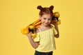 little child girl with yellow skateboard Royalty Free Stock Photo