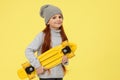 little child girl with yellow skateboard Royalty Free Stock Photo