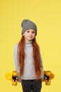 little child girl with yellow skateboard Royalty Free Stock Photo