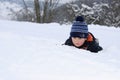 Little child having fun on snow