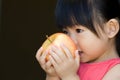 A little child hold a red apple