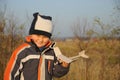 Little child holding plane model