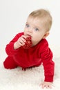 Little child holding a toy in his mouth Royalty Free Stock Photo