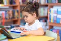 Happy child little girl pianist plays on a toy piano. Royalty Free Stock Photo