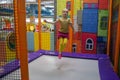 Little child jumping at trampoline in indoors playground. Active toddler girl having fun at sport centre Royalty Free Stock Photo