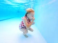 Little Child Learning to Swim Under Water