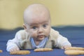 The little child lies on the bed with Royalty Free Stock Photo