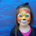 Little child with lion face painting Royalty Free Stock Photo