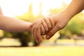 Little child and mother holding hands , closeup. Family weekend Royalty Free Stock Photo