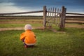 Little child opening  old gates. The storm approaching Royalty Free Stock Photo