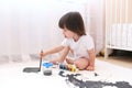 Little child painting with brush and gouache Royalty Free Stock Photo