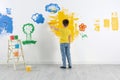 Little child painting wall with roller brush Royalty Free Stock Photo